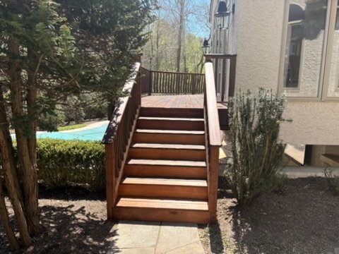 Stained wooden deck stairs and railings